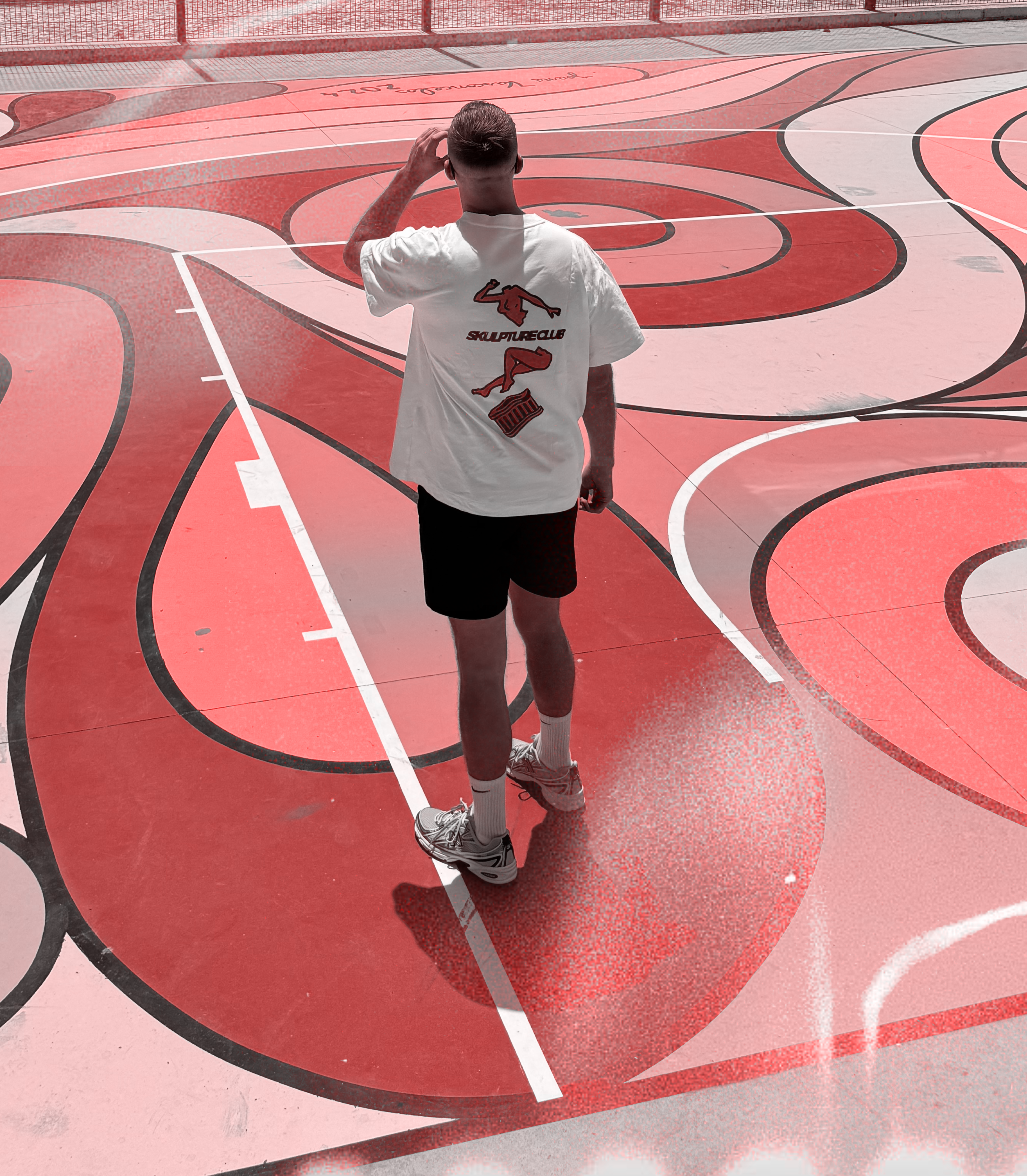 White oversized graphic tee with white Skulpture Club illustration